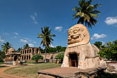 The great Chola temples of Tamil Nadu - The Brihadisvara temple of Gangaikondacholapuram. The large lion (Simakhinar) built over the flight of steps descending to a water tank. 